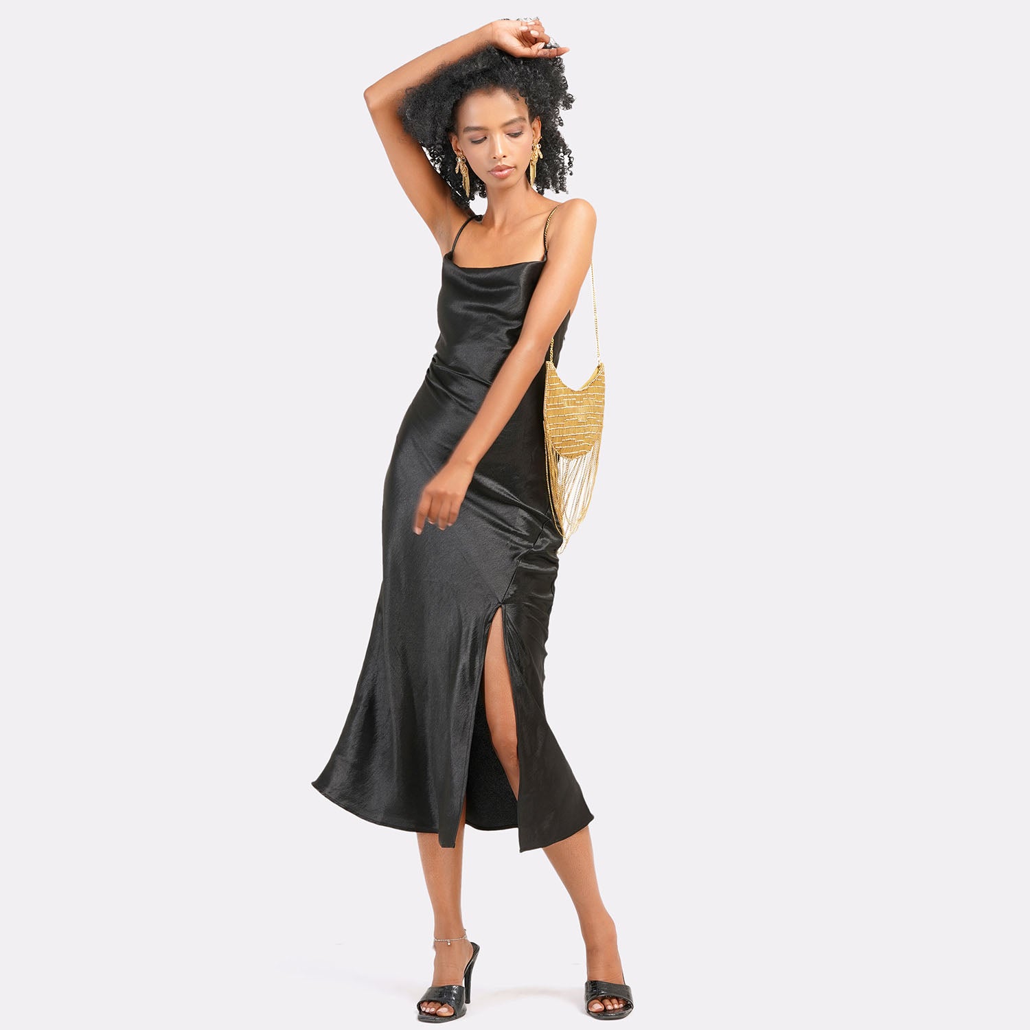 Twirl & Tassel Clutch Bag